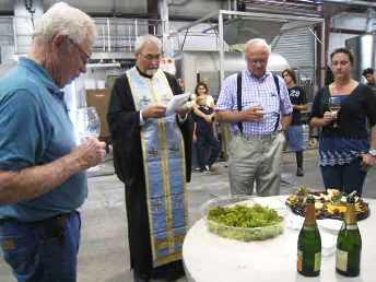 Father John Finley blesses the Lucas & Lewellen harvest Father John Finley blesses the Lucas & Lewellen harvest