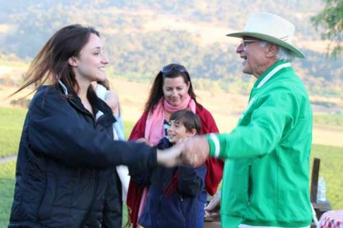 The Dirtman dances with his daughter at the Wine Club Summer BBQ