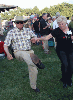 Louis Lucas dancing with wine club member Lori