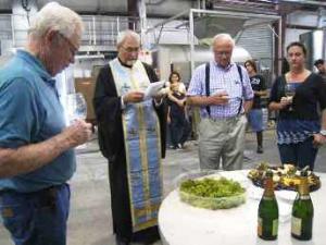 Father John Finley blesses the Lucas & Lewellen harvest Father John Finley blesses the Lucas & Lewellen harvest