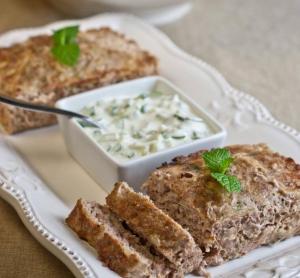 A photo of Gyro Meatloaf with Tzatziki Sauce